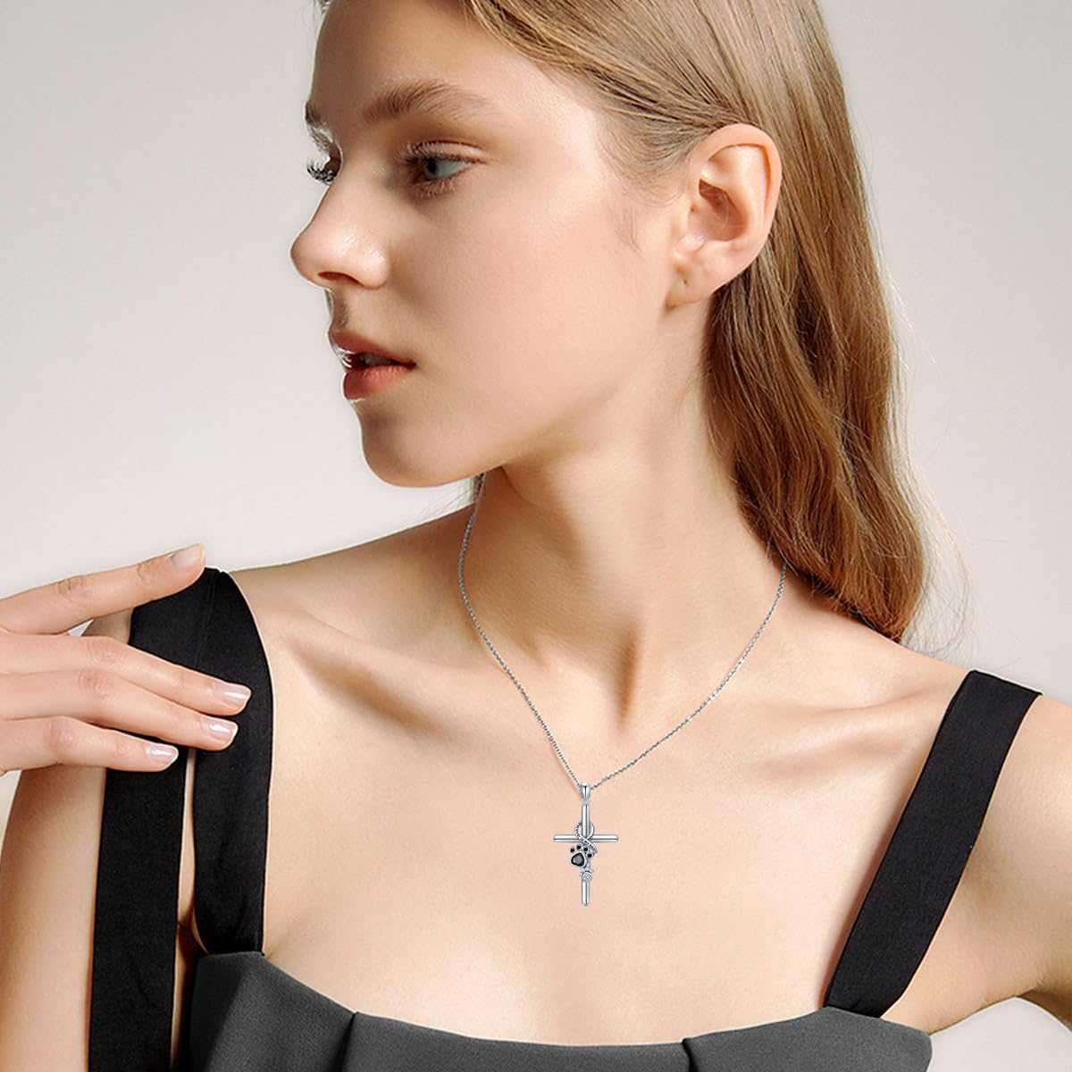 Silver Pendant Featuring Paw Print and Cross Design