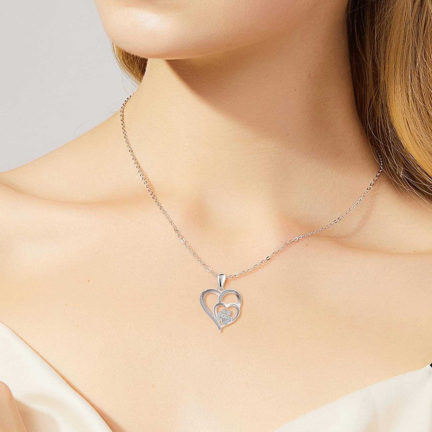 Sterling Silver Paw Print and Heart Necklace Adorned with Zirconia