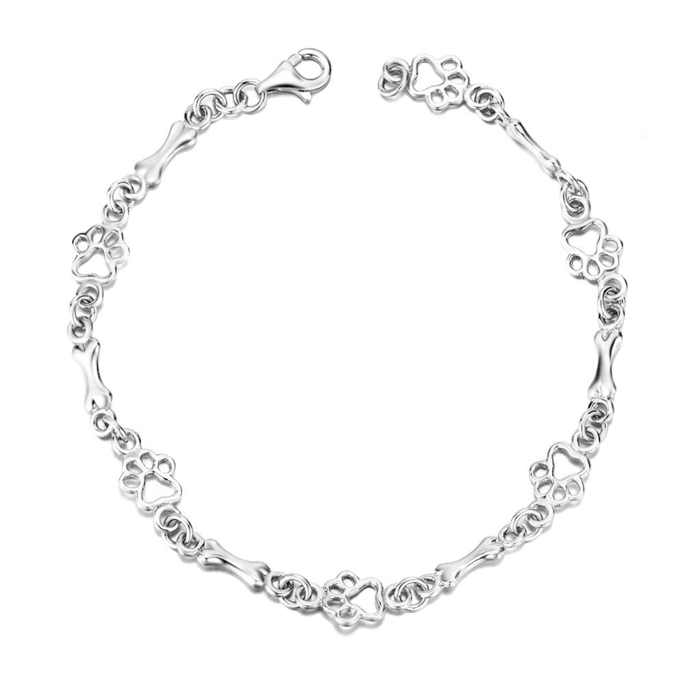 Silver Bracelet Featuring Dog Paw and Bone Charms