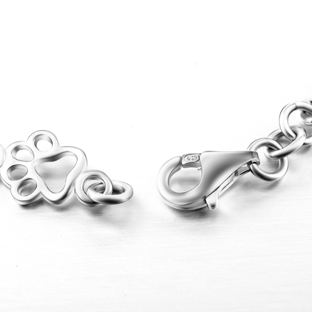 Silver Bracelet Featuring Dog Paw and Bone Charms